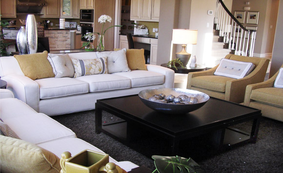 Contemporary San Antonio residence, family room. White, gray and gold scheme, custom upholstery with silver accent pieces.